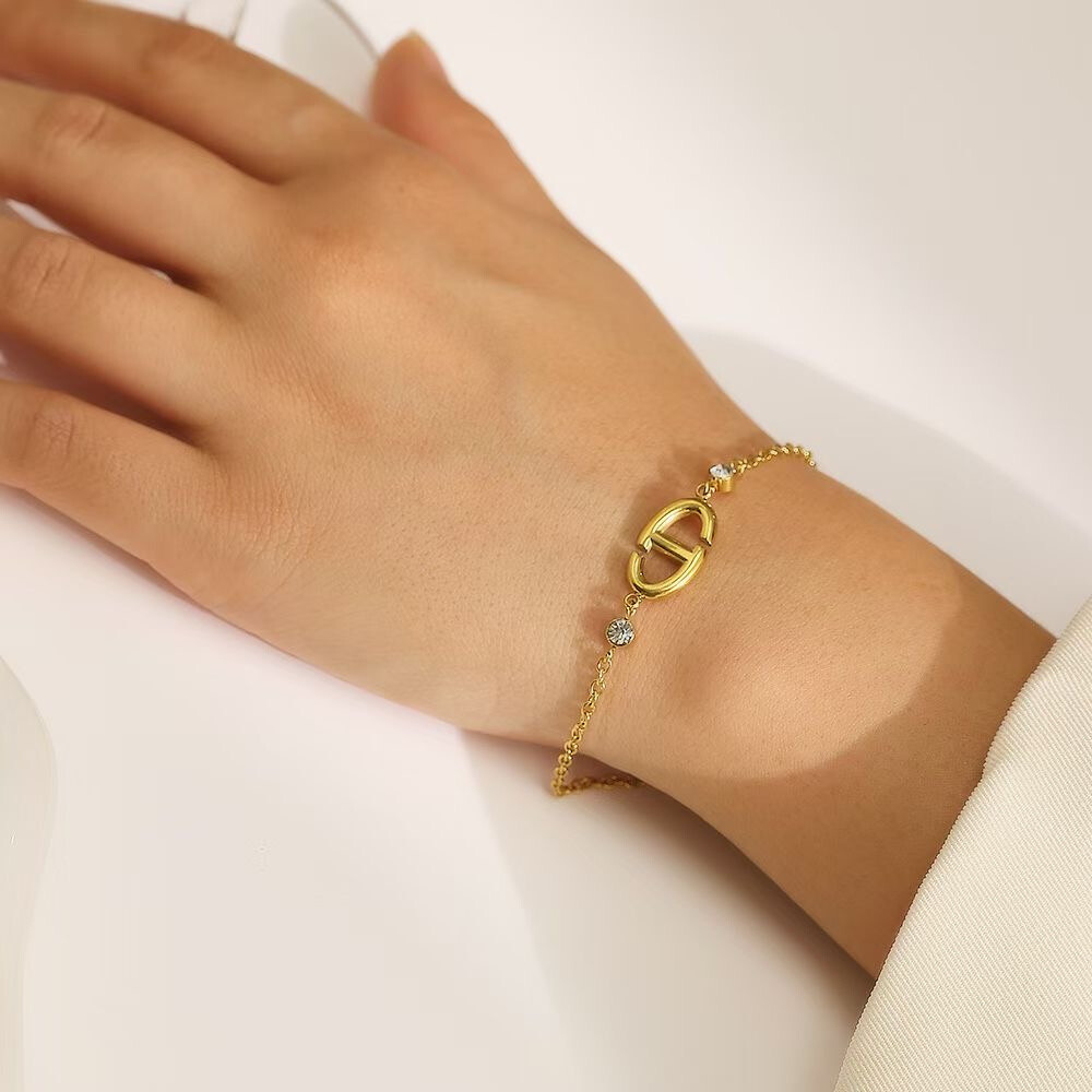 Wholesaler COSMOS - Geometric oval motif bangle bracelet adorned with rhinestones