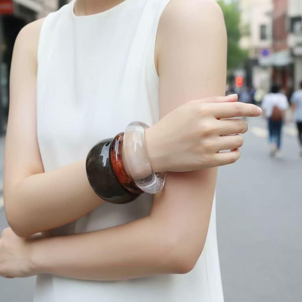 Wholesaler COSMOS - Set of 3 women's bracelets in brown, transparent, and amber resin