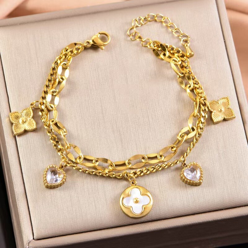 Grossiste COSMOS - Bracelet Fleurs Nacre Doré Acier Inoxydable Élégance Nature