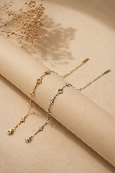 Wholesaler COSMOS - Set of 2 stainless steel bracelets in gold and silver with delicate star and clover designs Wholesaler COSMOS - Set of 2 stainless steel bracelets in gold and silver with delicate star and clover designs