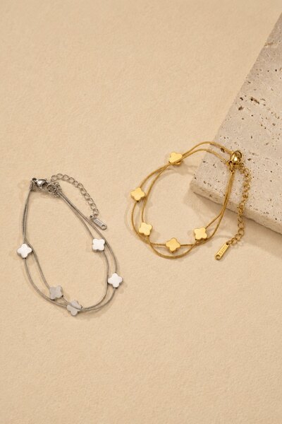 Wholesaler COSMOS - Set of 2 stainless steel bracelets in gold and silver with clover motifs and delicate double chain Wholesaler COSMOS - Set of 2 stainless steel bracelets in gold and silver with clover motifs and delicate double chain