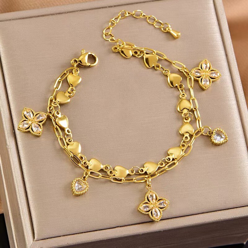 Grossiste COSMOS - Bracelet Charme Élégant Fleurs Cœurs Acier Inoxydable Doré