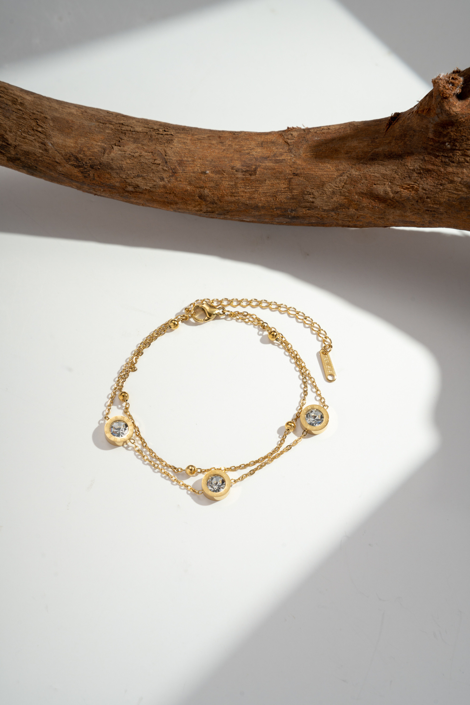 Grossiste COSMOS - Bracelet double tour Pendentif rond orné d’un cristal en acier