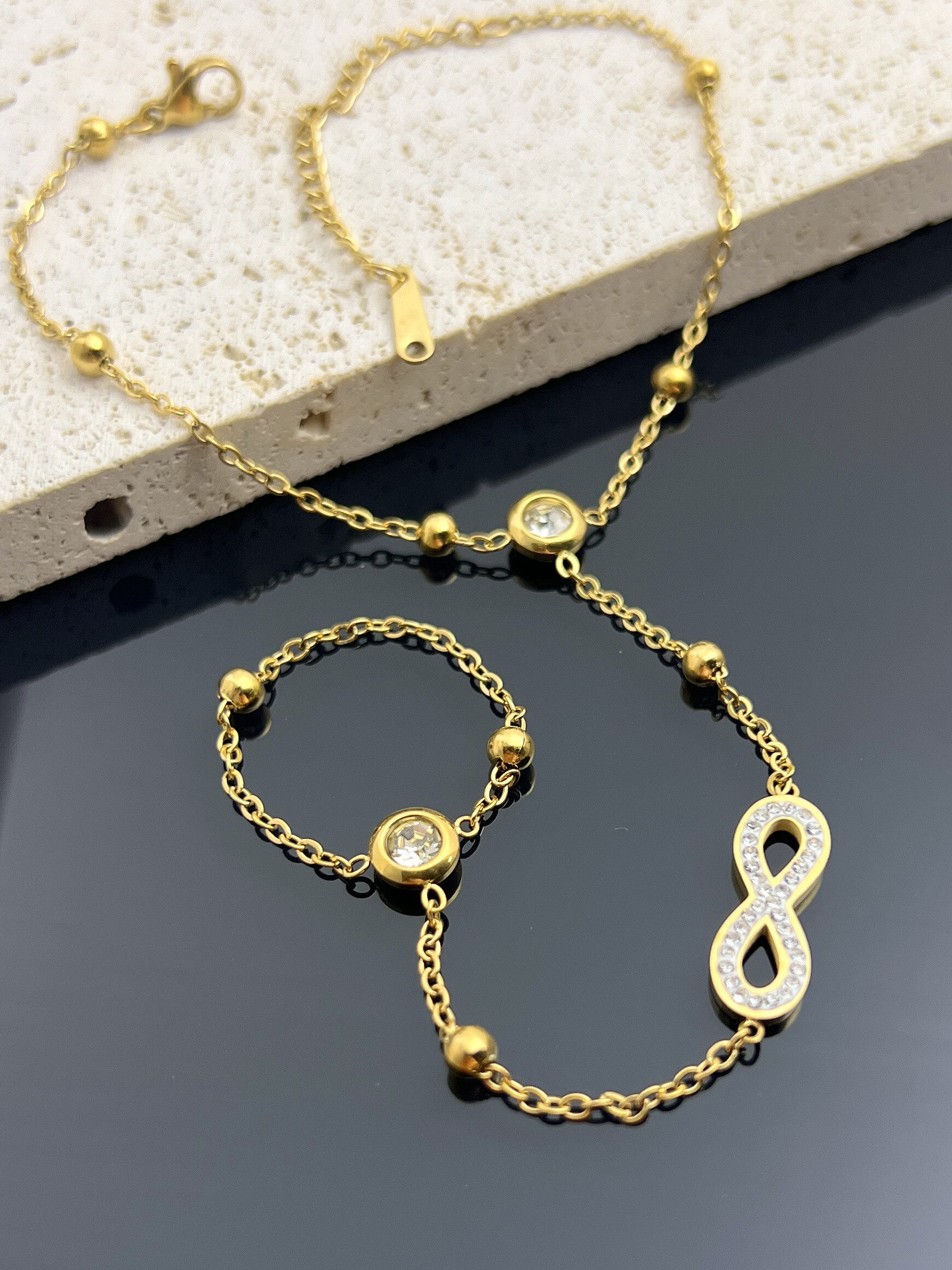 Wholesaler COSMOS - Infinite hand bracelet in stainless steel
