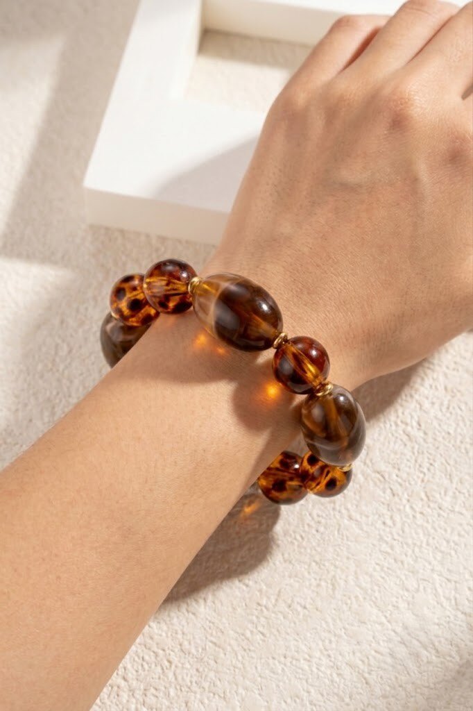 Grossista COSMOS - Bracciale elastico naturale caldo alla moda con perle marroni ambra marmorizzate