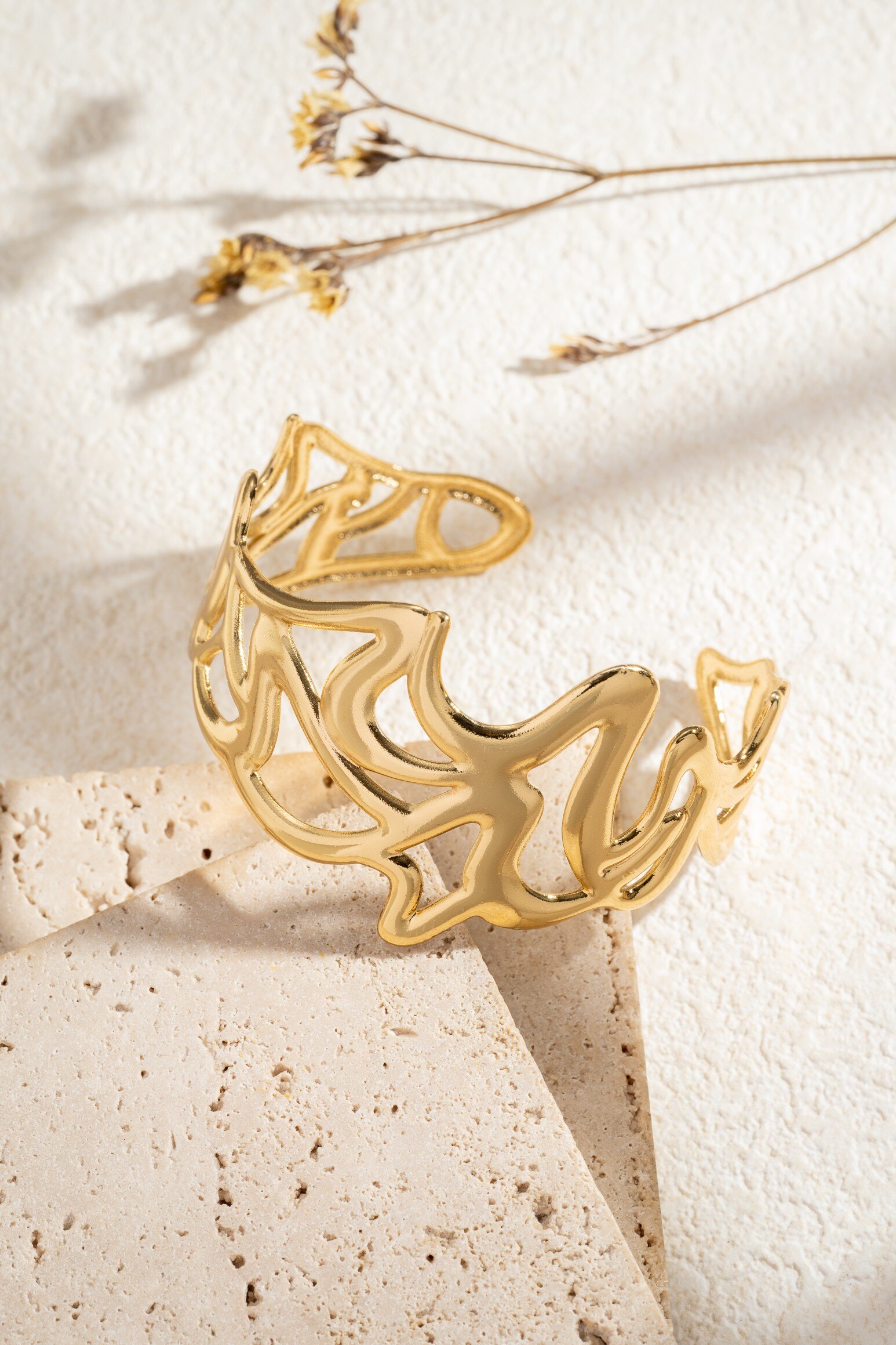 Wholesaler COSMOS - Gold-plated stainless steel cuff bracelet with openwork organic design, elegant women's jewelry