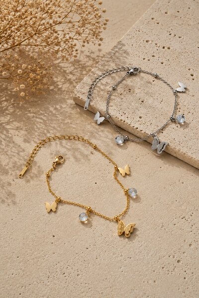 Wholesaler COSMOS - Set of 2 stainless steel bracelets in gold and silver with delicate, luminous butterfly designs Wholesaler COSMOS - Set of 2 stainless steel bracelets in gold and silver with delicate, luminous butterfly designs