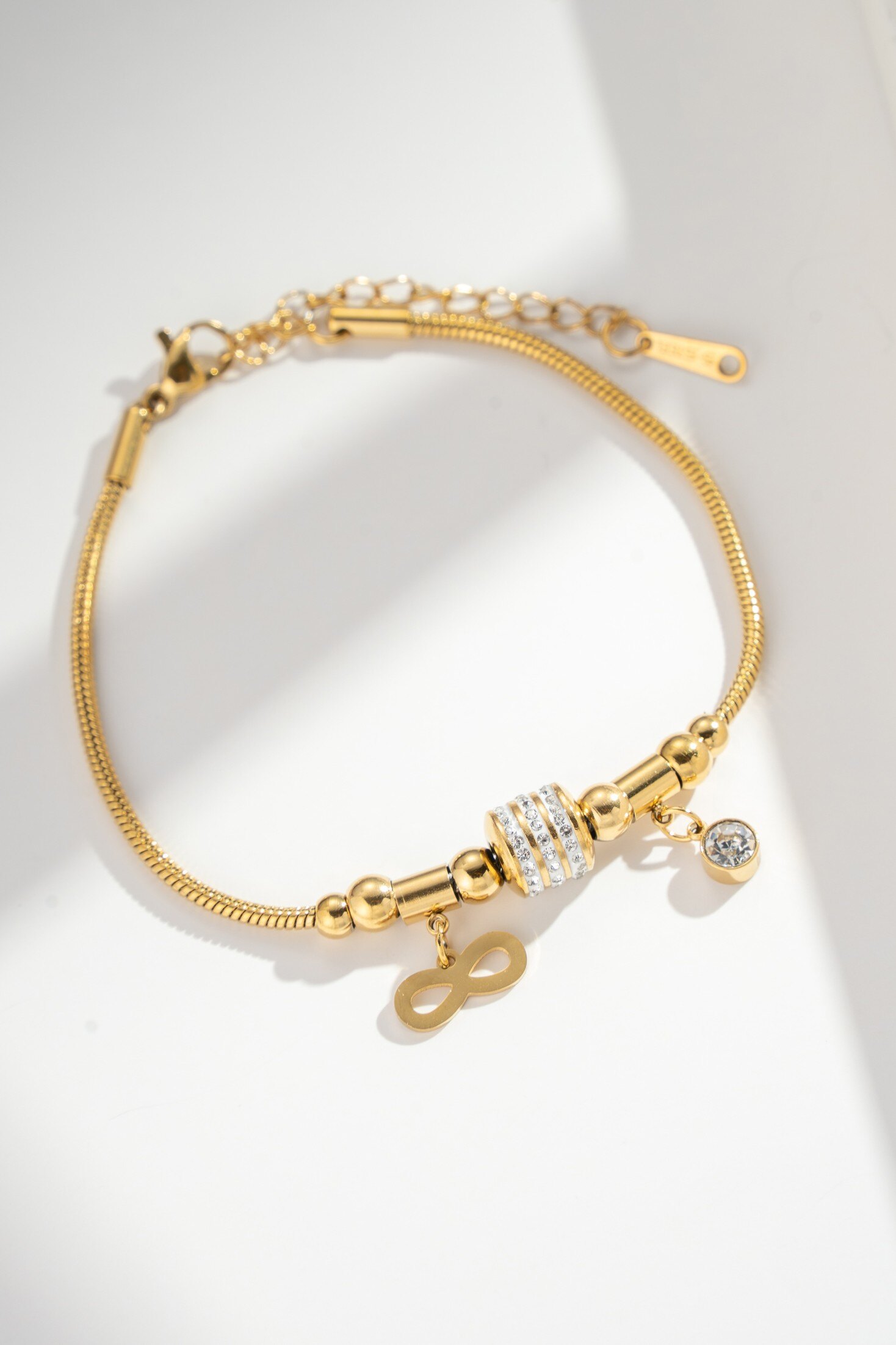 Wholesaler COSMOS - Gold-Plated Steel Infinity Bracelet with Rhinestones - Chic Elegance for Fashionable Celebrations