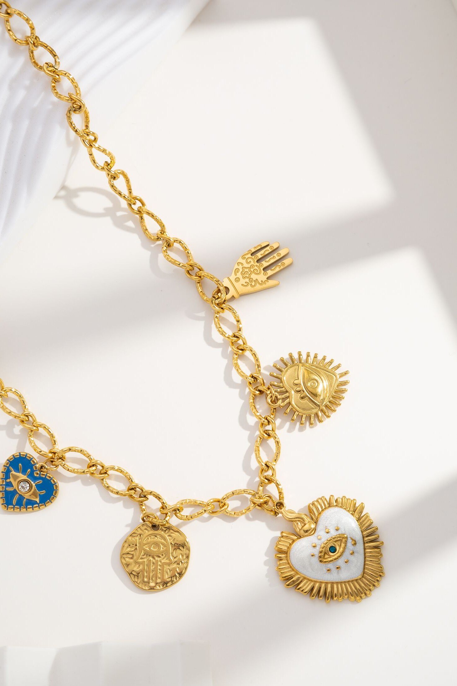 Grossiste COSMOS - Collier doré charms protecteurs main cœur œil porte‑bonheur acier inoxydable élégant