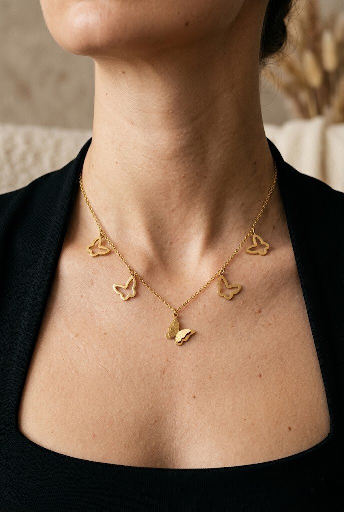 Wholesaler COSMOS - Delicate gold butterfly necklace in stainless steel, feminine and elegant with a nature motif