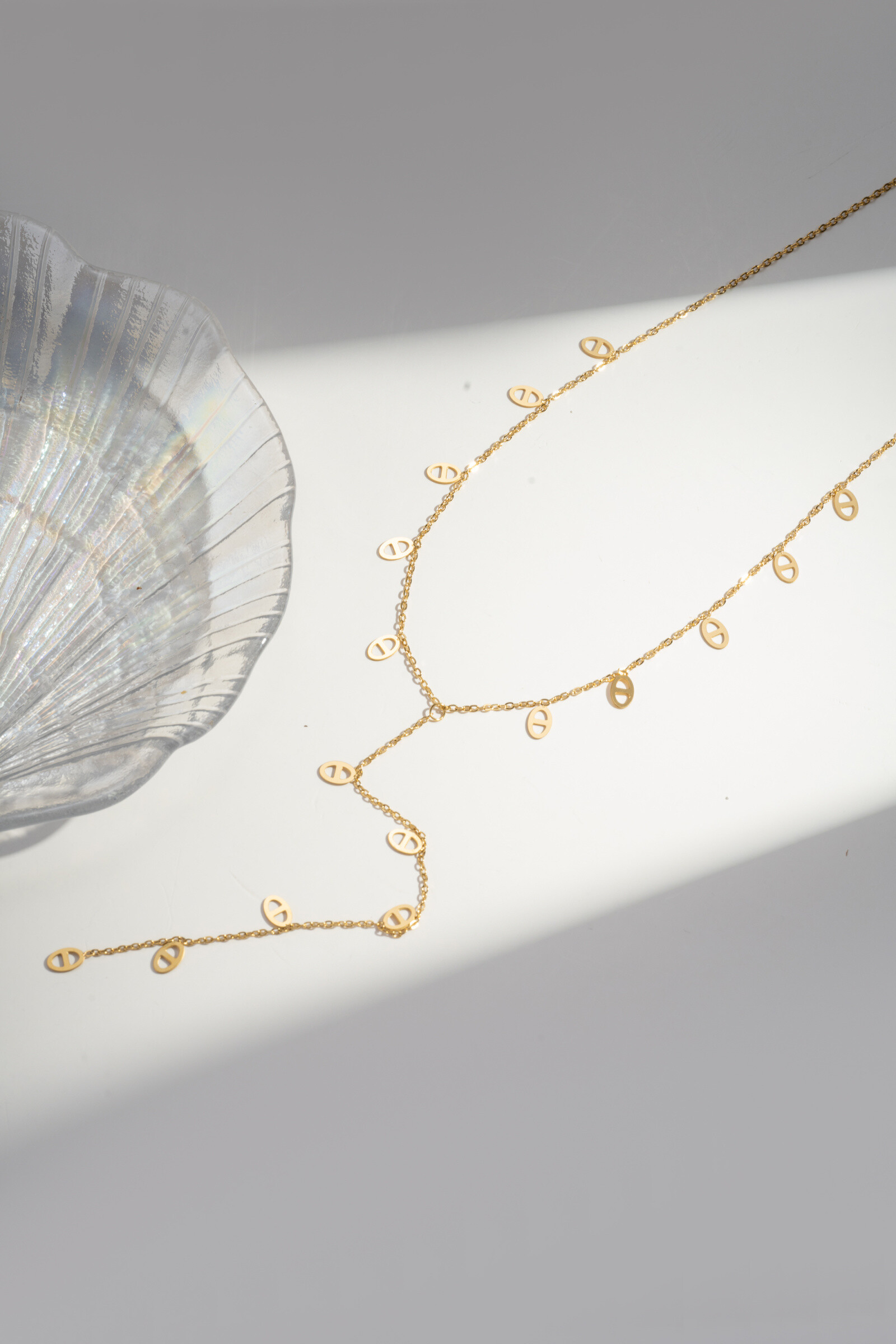 Wholesaler COSMOS - Golden y -shaped necklace in stainless steel
