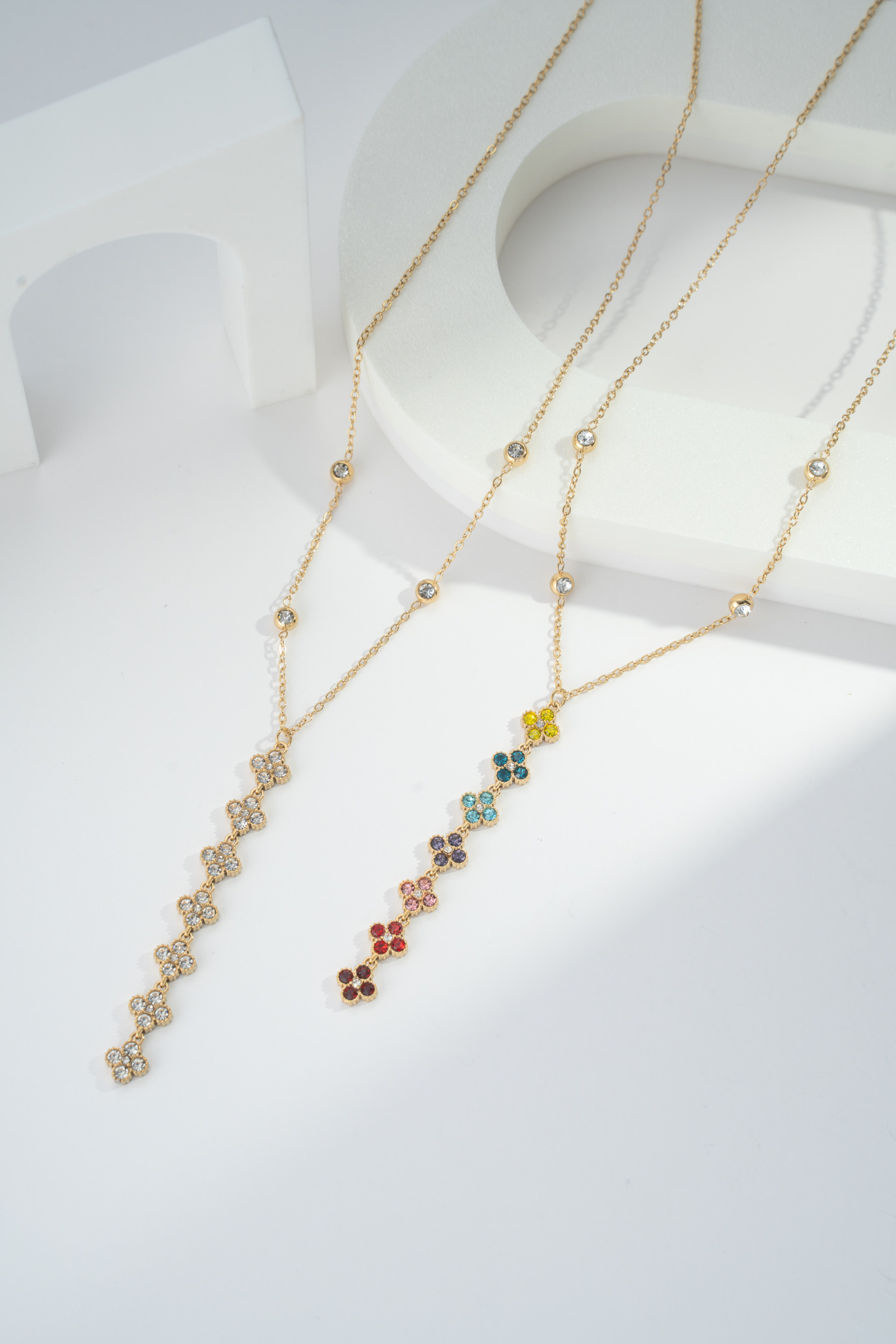 Wholesaler COSMOS - Women's stainless steel necklace with multicolored crystal drop flowers and gold beaded petals, elegant adjustable chain