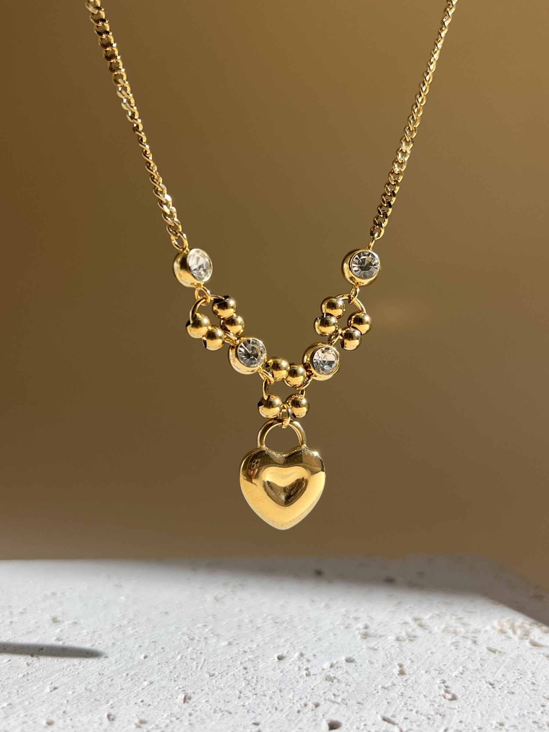 Grossista COSMOS - Collana in Acciaio Inossidabile – Ciondolo Cuore Dorato Brillante