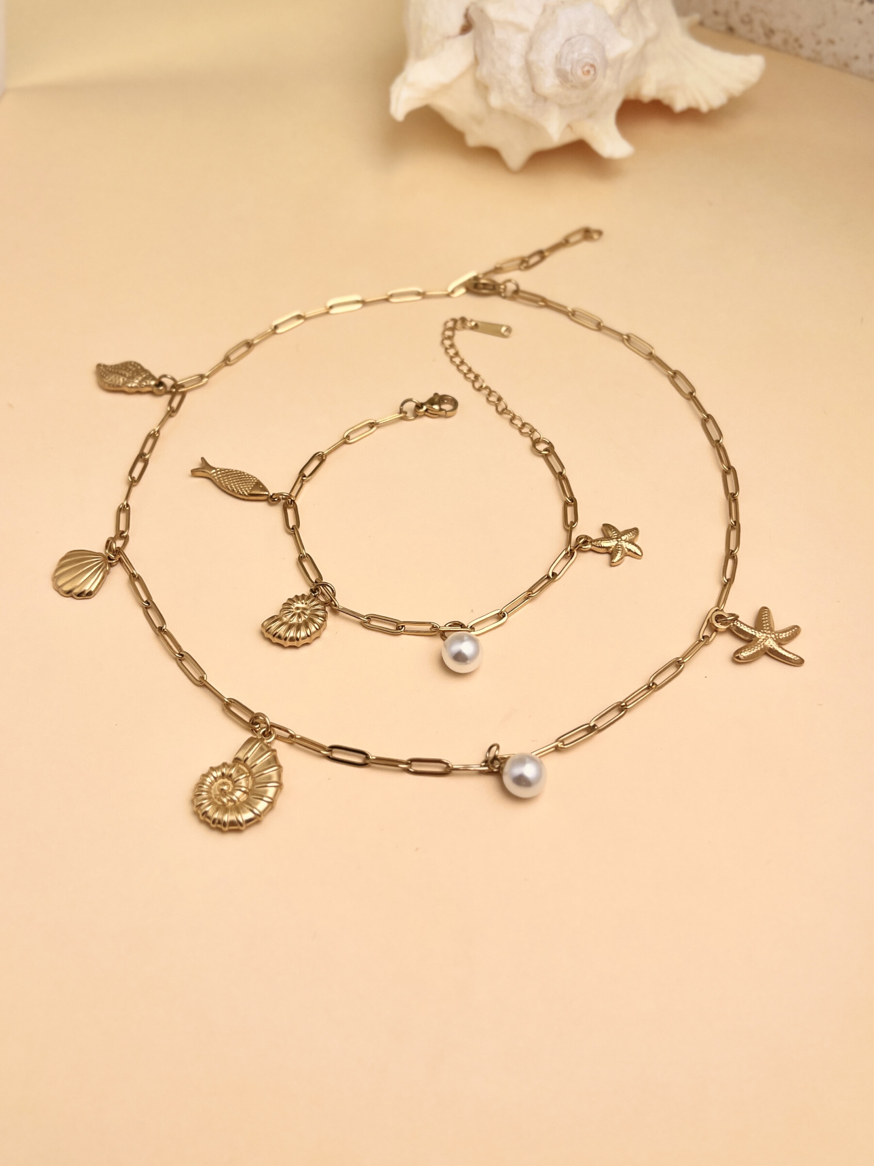 Wholesaler COSMOS - Necklace and Bracelet Set - Marine Charms: Starfish, Seashell & Sea Snail