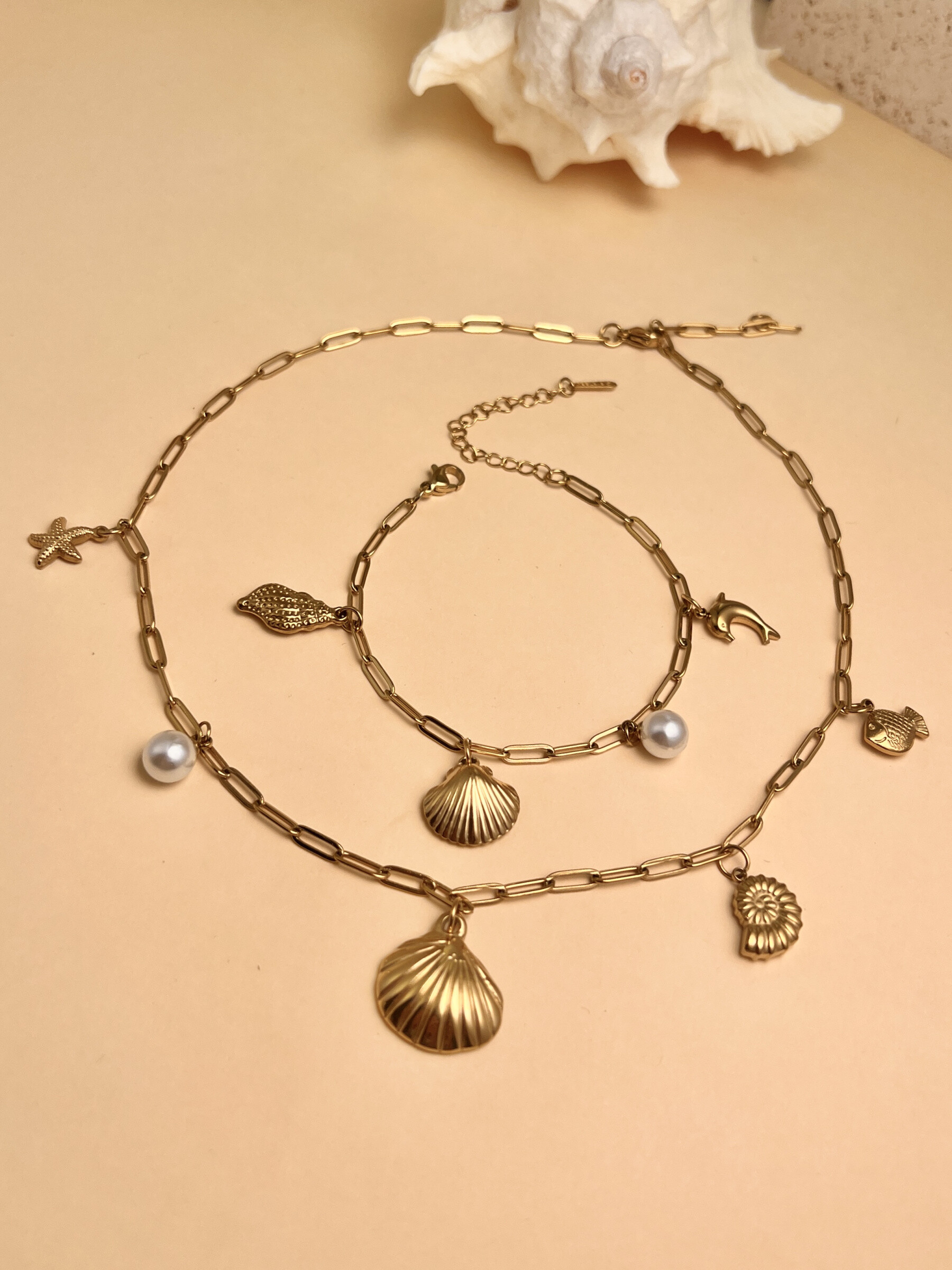 Wholesaler COSMOS - Necklace and Bracelet Set - Marine Charms: Starfish, Seashell & Sea Snail