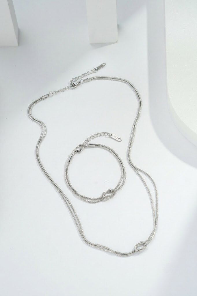 Grossiste COSMOS - +Parure nœud collier bracelet acier inoxydable, chaînette fine élégante moderne tendance