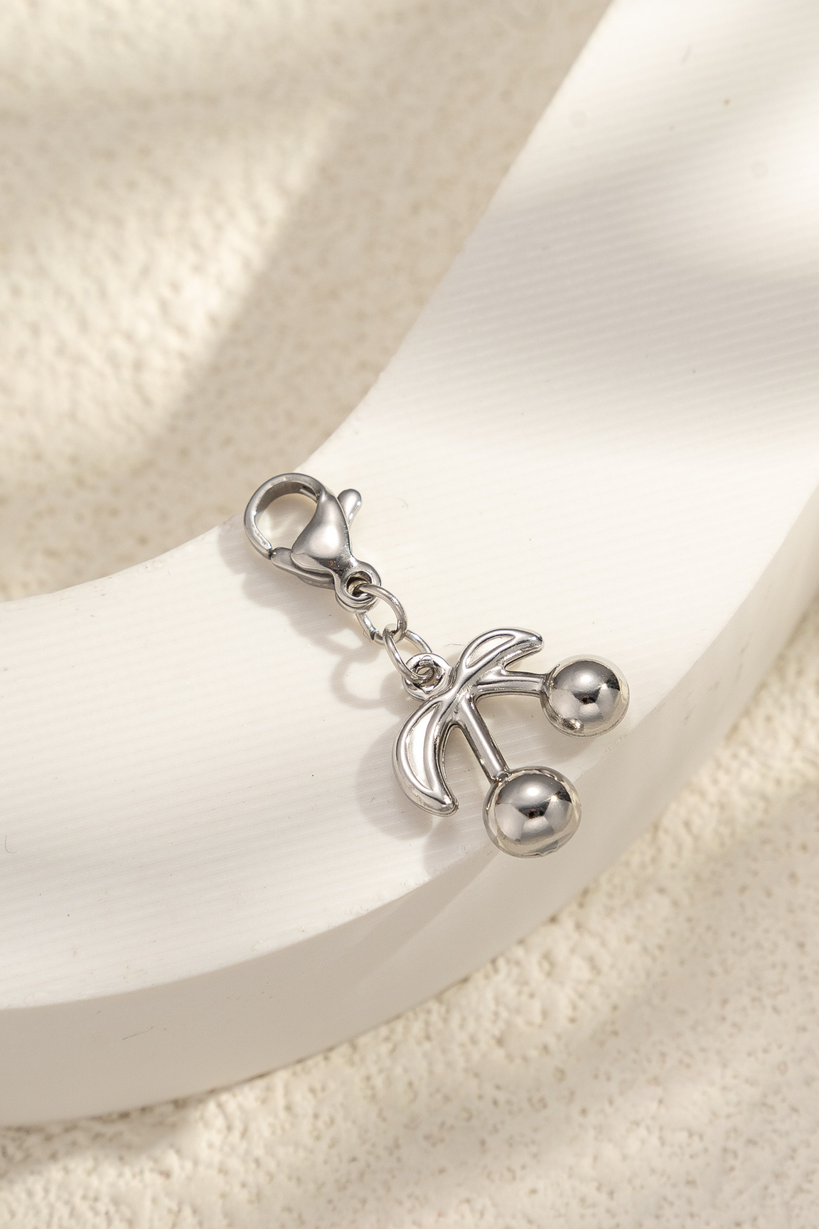 Wholesaler COSMOS - Stainless steel pendant with sleek, shiny, elegant minimalist cherries - modern chic trend