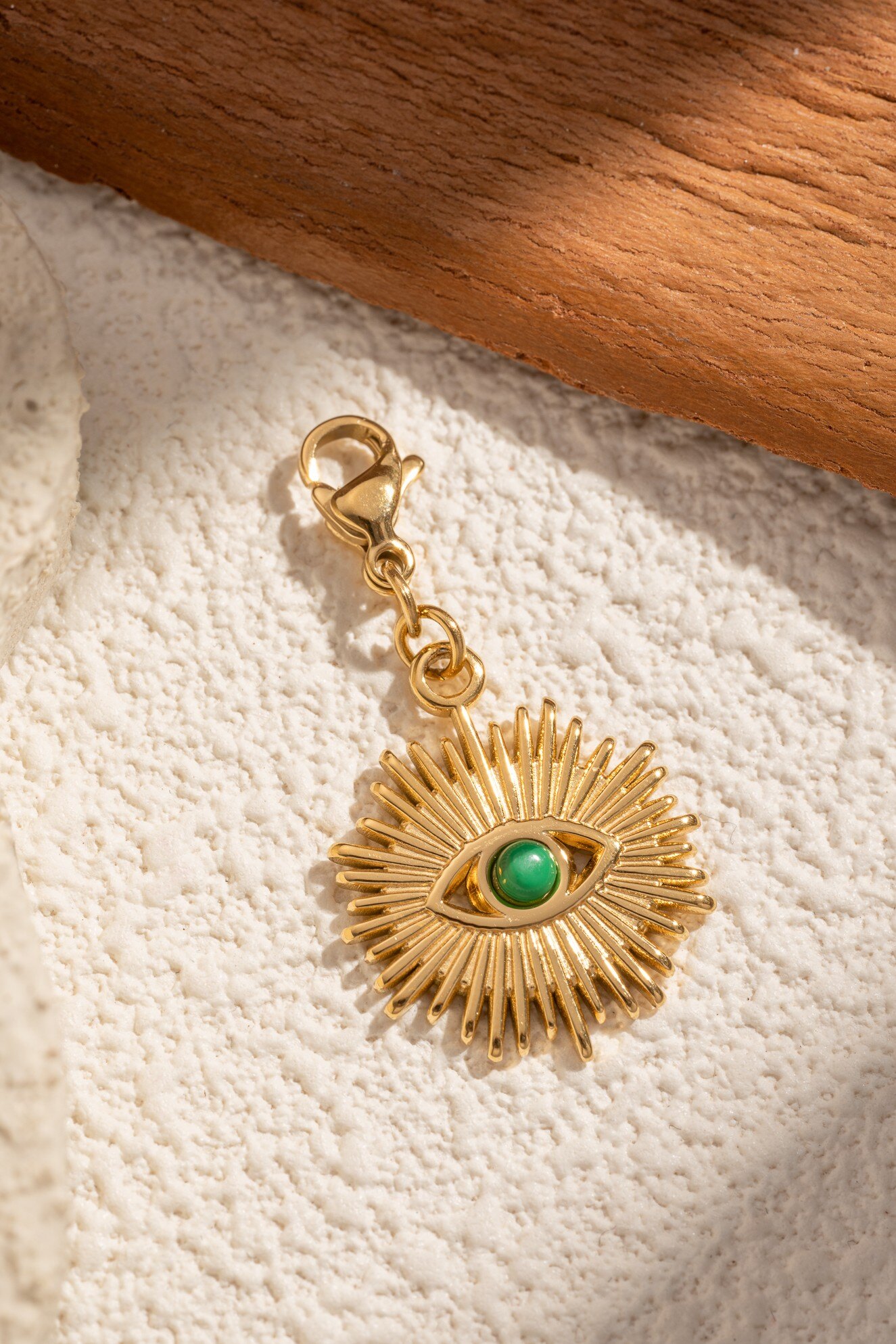 Wholesaler COSMOS - Golden sun pendant with green eye rhinestones, chic protective trendy luminous for women