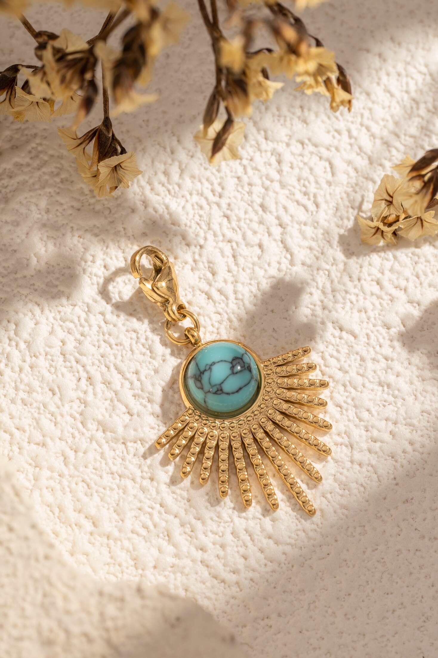 Wholesaler COSMOS - Sun pendant charms adorned with turquoise stone in elegant, luminous stainless steel
