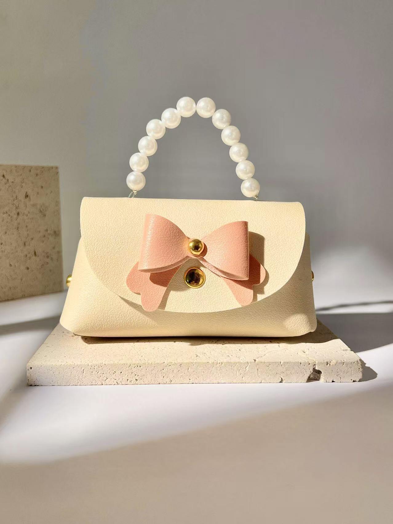Grossiste COSMOS - Mini Sac Cadeau Chic Mignon avec Perles et Nœud Élégant