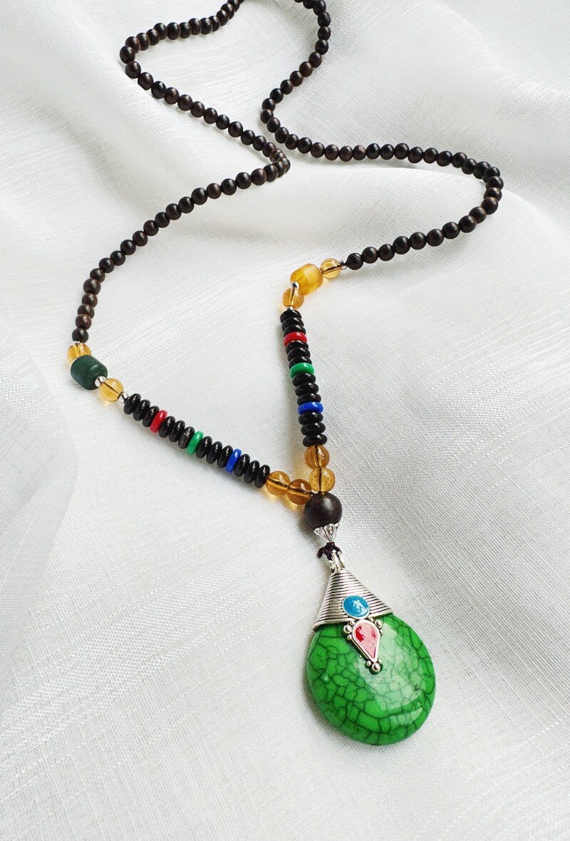 Grossiste D Bijoux - Sautoir perles, bois et pendentif style ethnique