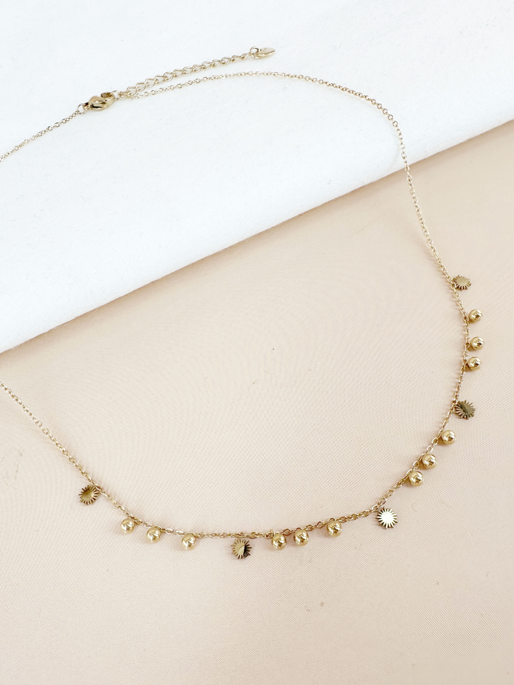 Grossiste D Bijoux - Collier perles et soleil en acier inoxydable