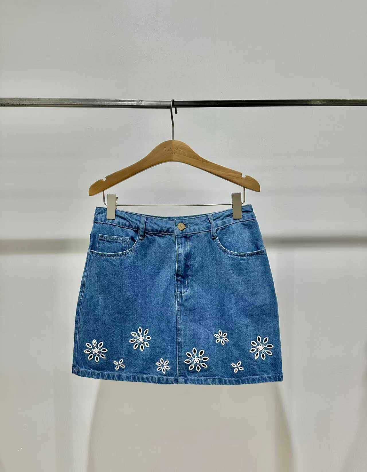Short denim skirt with white floral embroidery