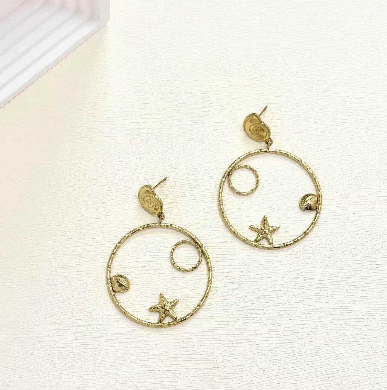 Grossiste Eclador Bijoux - Boucles d’oreilles en acier Inoxydable motif coquillages