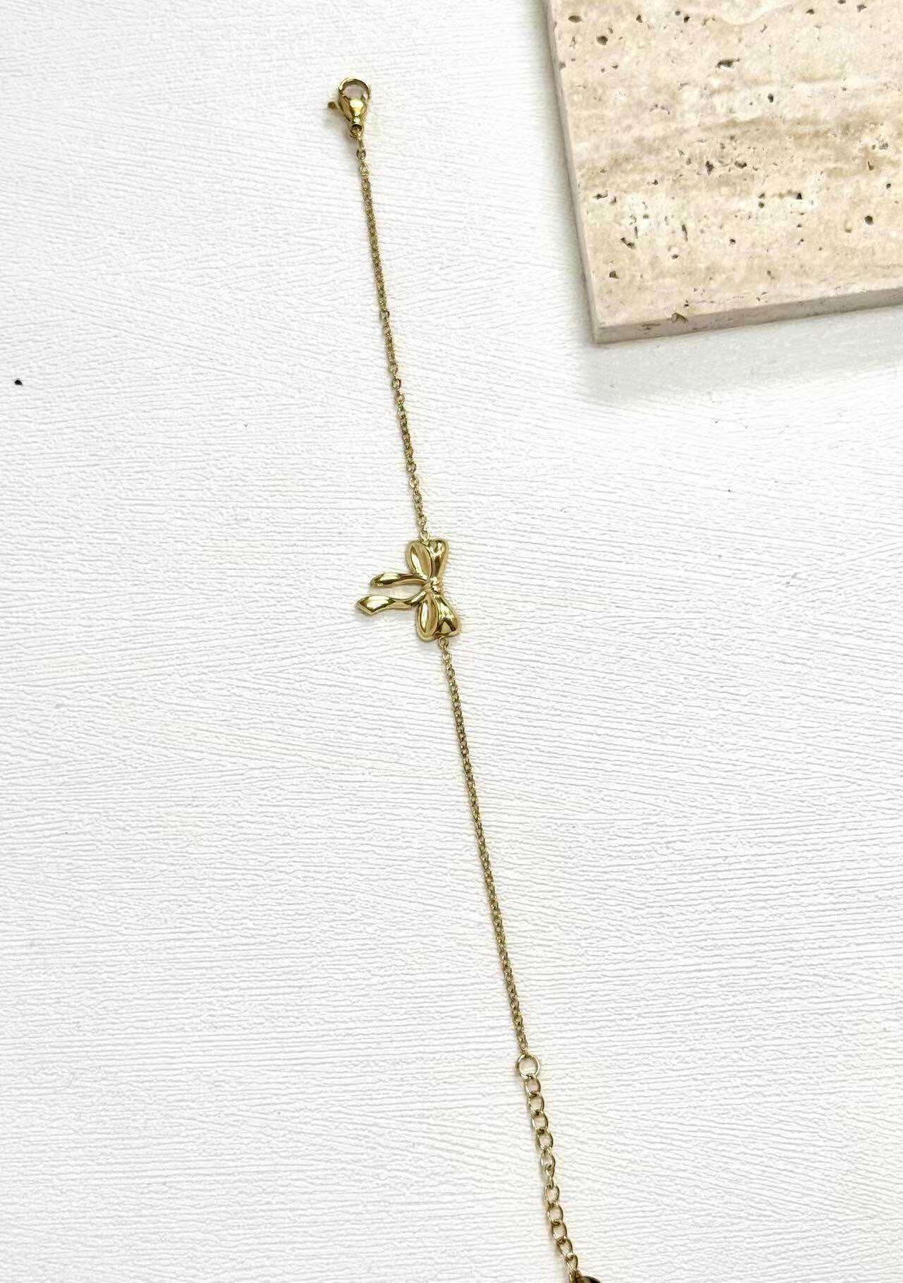 Grossiste Eclador Bijoux - Bracelet fin en acier Inoxydable avec un pendentif de noeud de papillon