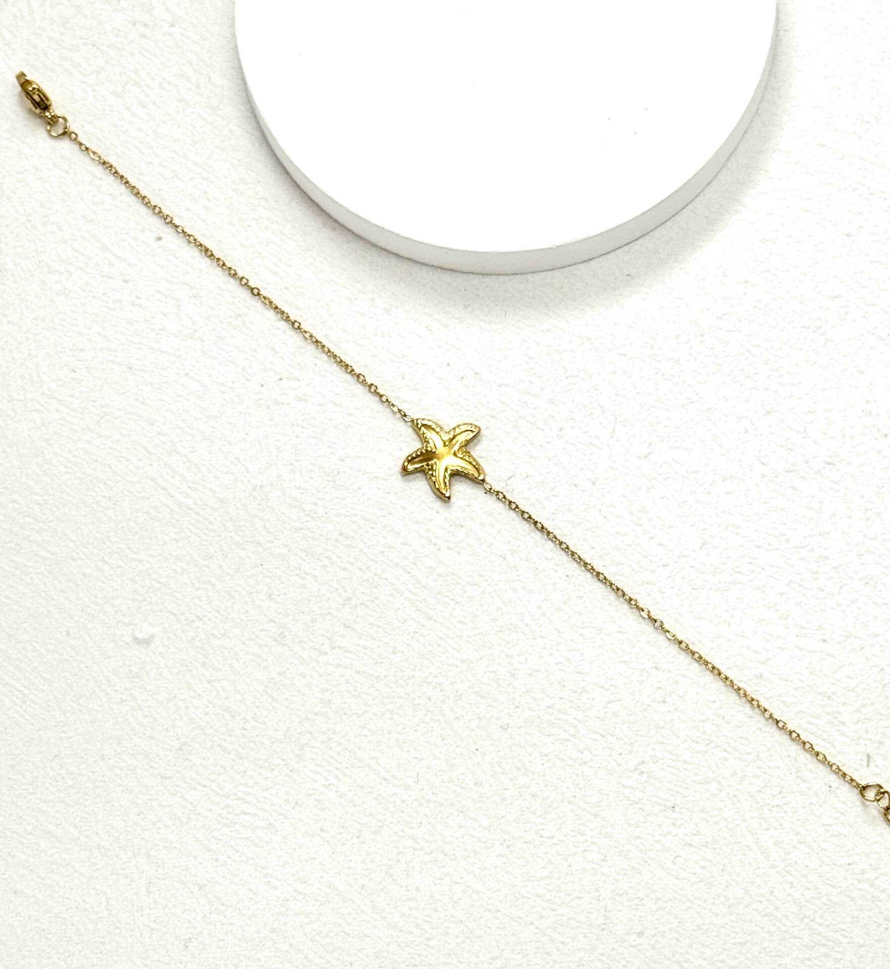 Grossista Eclador Bijoux - Bracciale in acciaio inossidabile, decorato con diversi piccoli pendenti circolari.