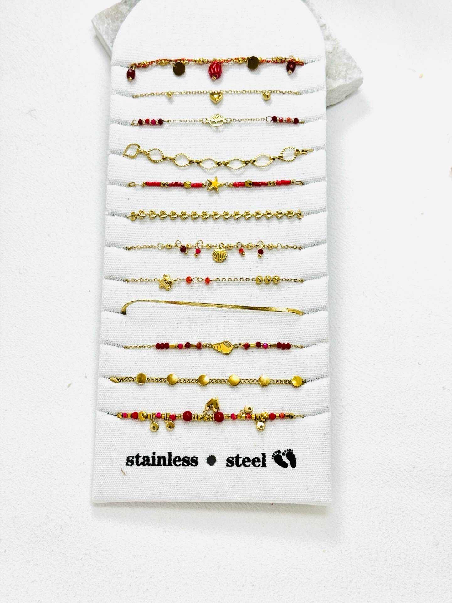 Grossista Eclador Bijoux - Bracciale in acciaio inossidabile, decorato con diversi piccoli pendenti circolari.