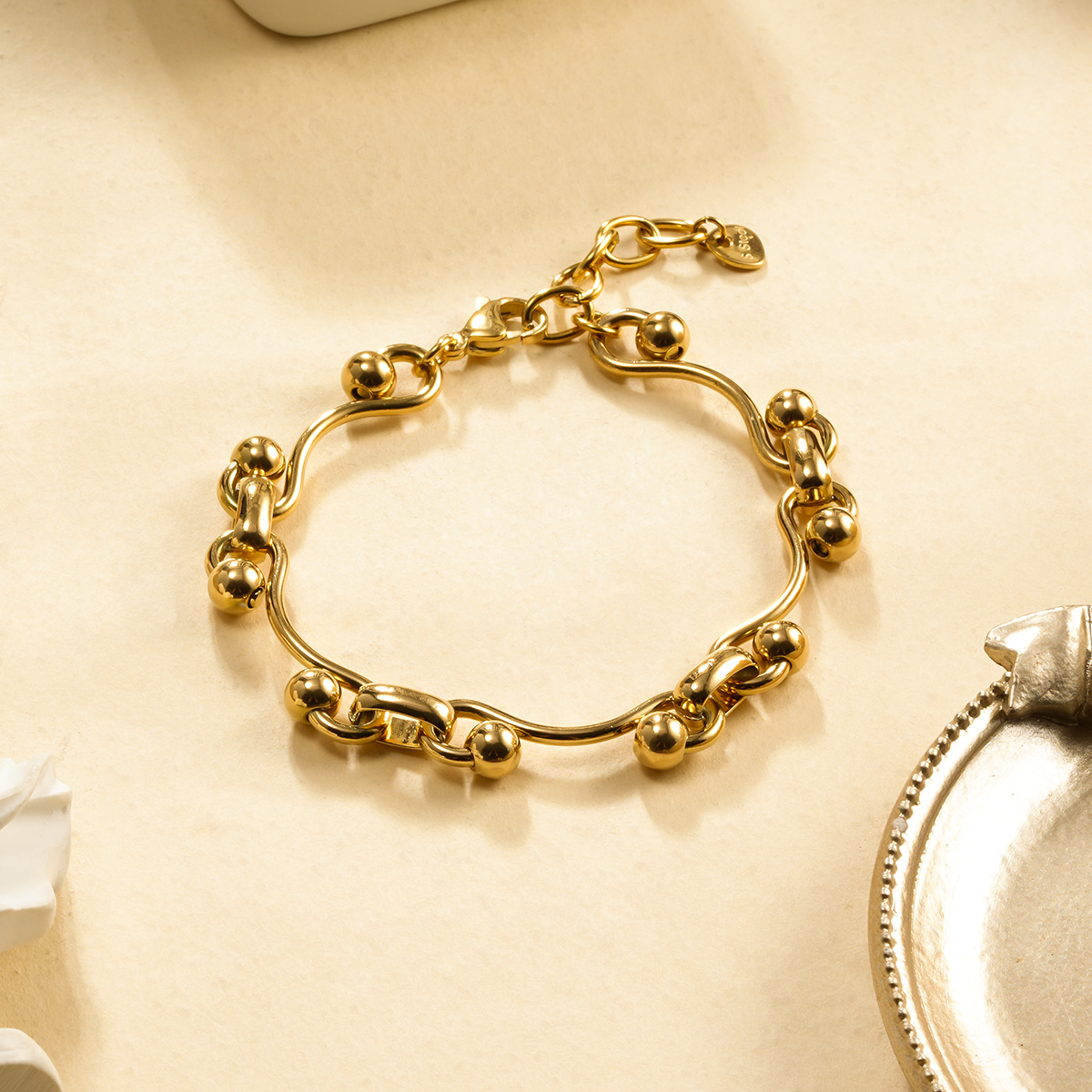 Wholesaler Eclat Paris - Golden Chain Bracelet with Wavy Links and Shiny Sphere Bead