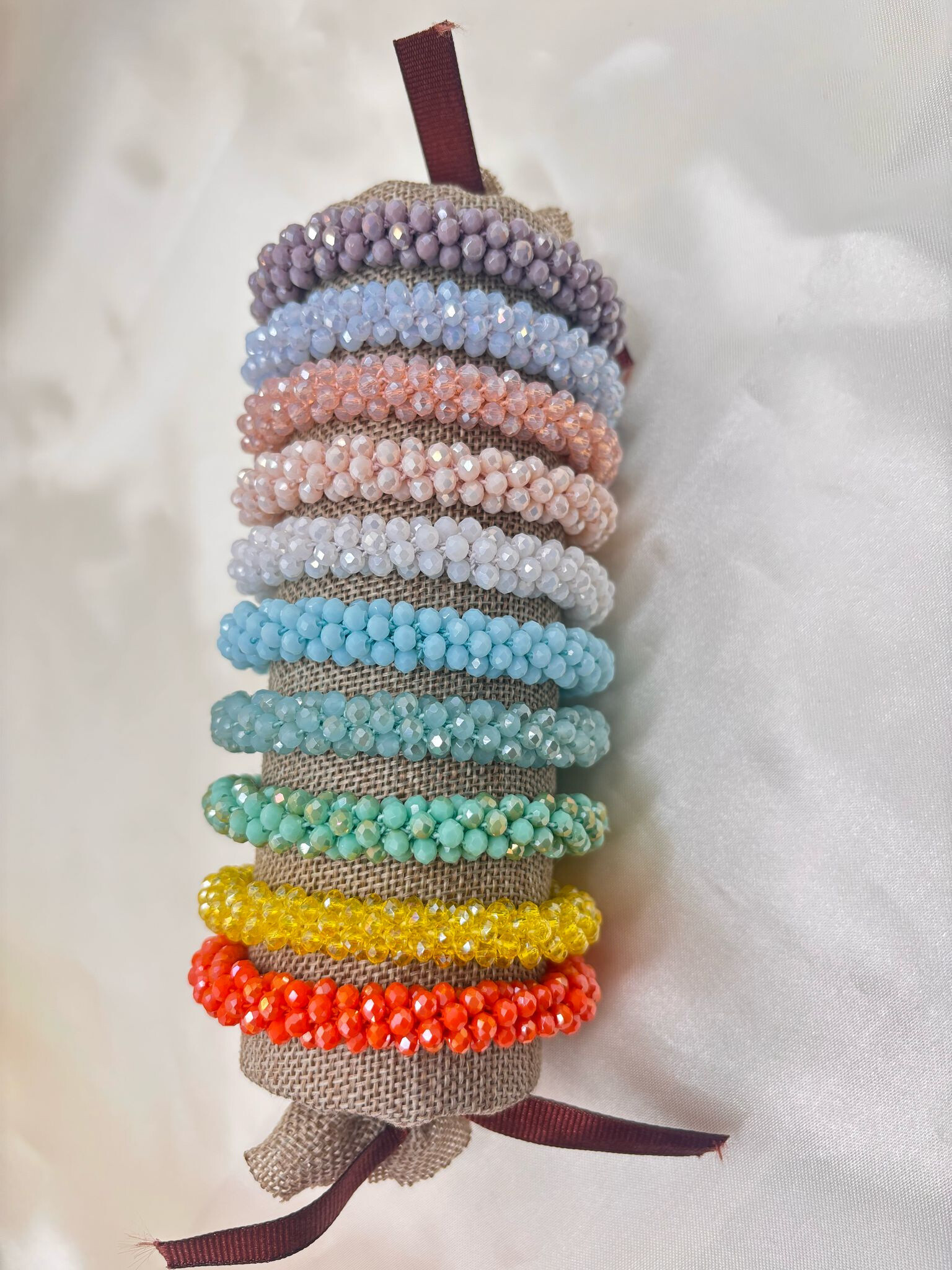 Wholesaler Eclat Paris - Set of 10 colored elastic bracelets on display