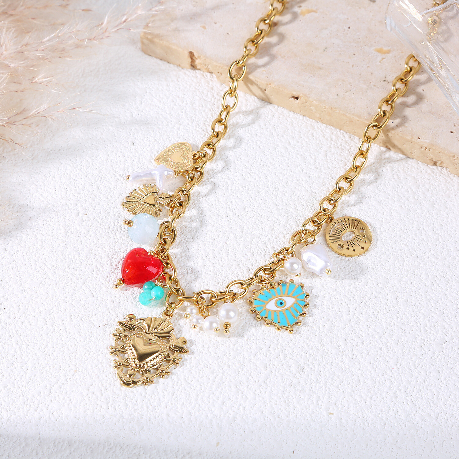 Grossiste Eclat Paris - Collier chaîne dorée avec breloques ex voto et œil