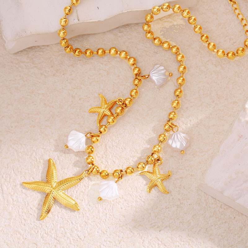 Wholesaler Eclat Paris - Golden pearl chain necklace with beach pendants