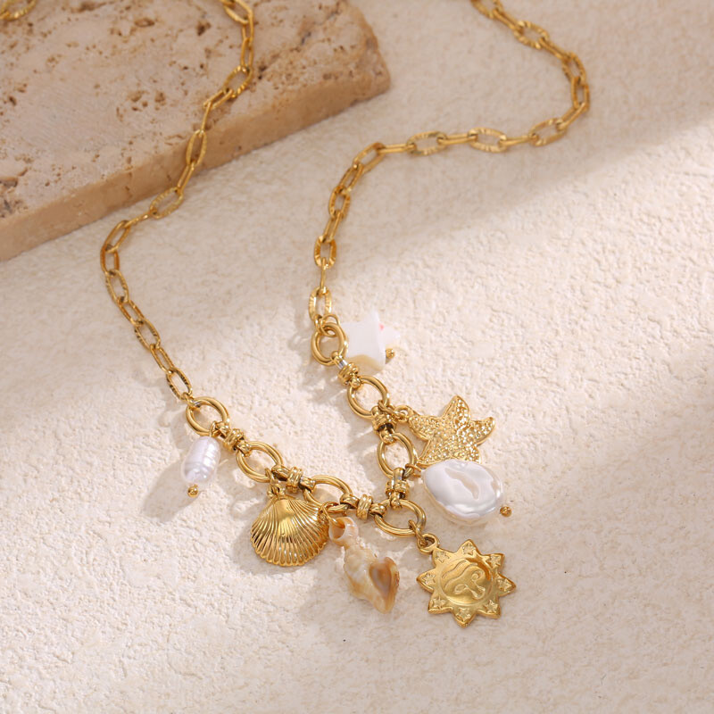 Wholesaler Eclat Paris - Textured golden links collar with ocean pendants