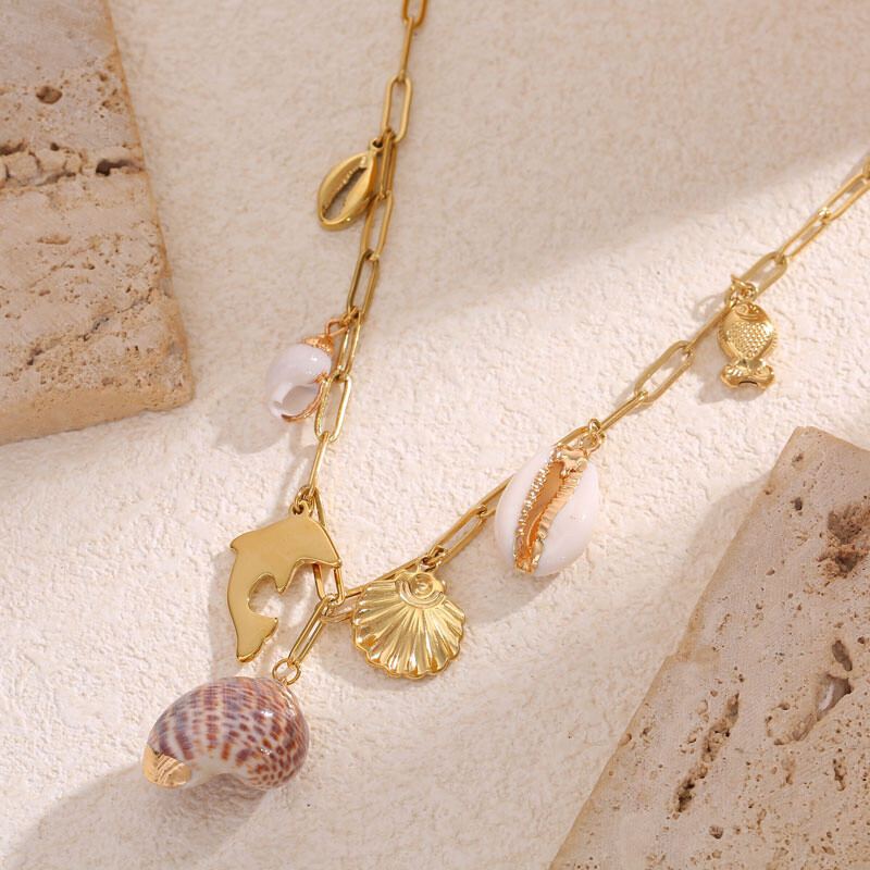 Wholesaler Eclat Paris - Golden chain necklace with dolphin, shells and fish pendants
