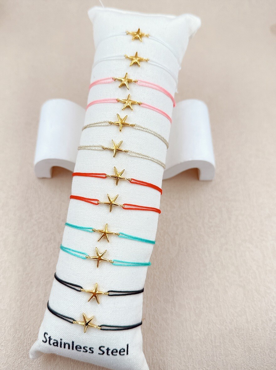 Grossista Ella Ella - SET DI 12 BRACCIALETTI IN ACCIAIO INOSSIDABILE SU CUSCINO