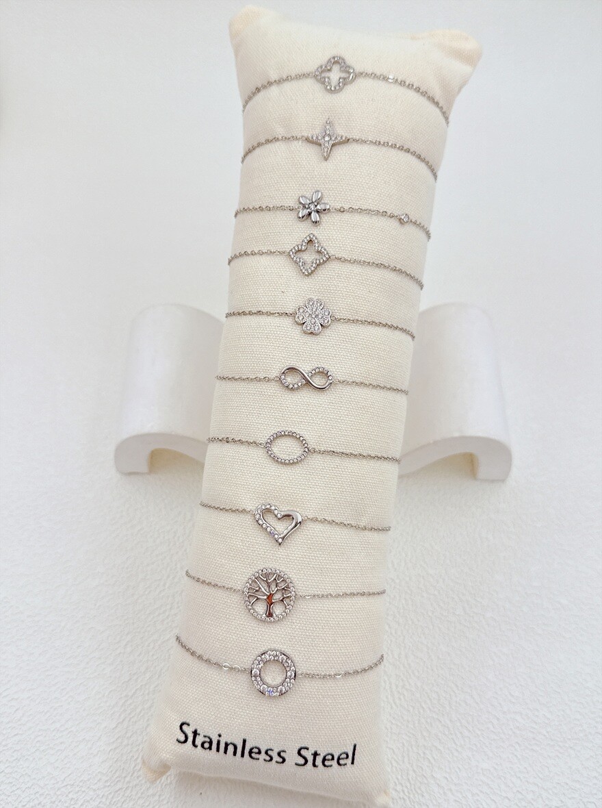 Grossiste Ella Ella - LOT DE 10 BRACELETS EN ACIER INOXYDABLE SUR COUSSIN