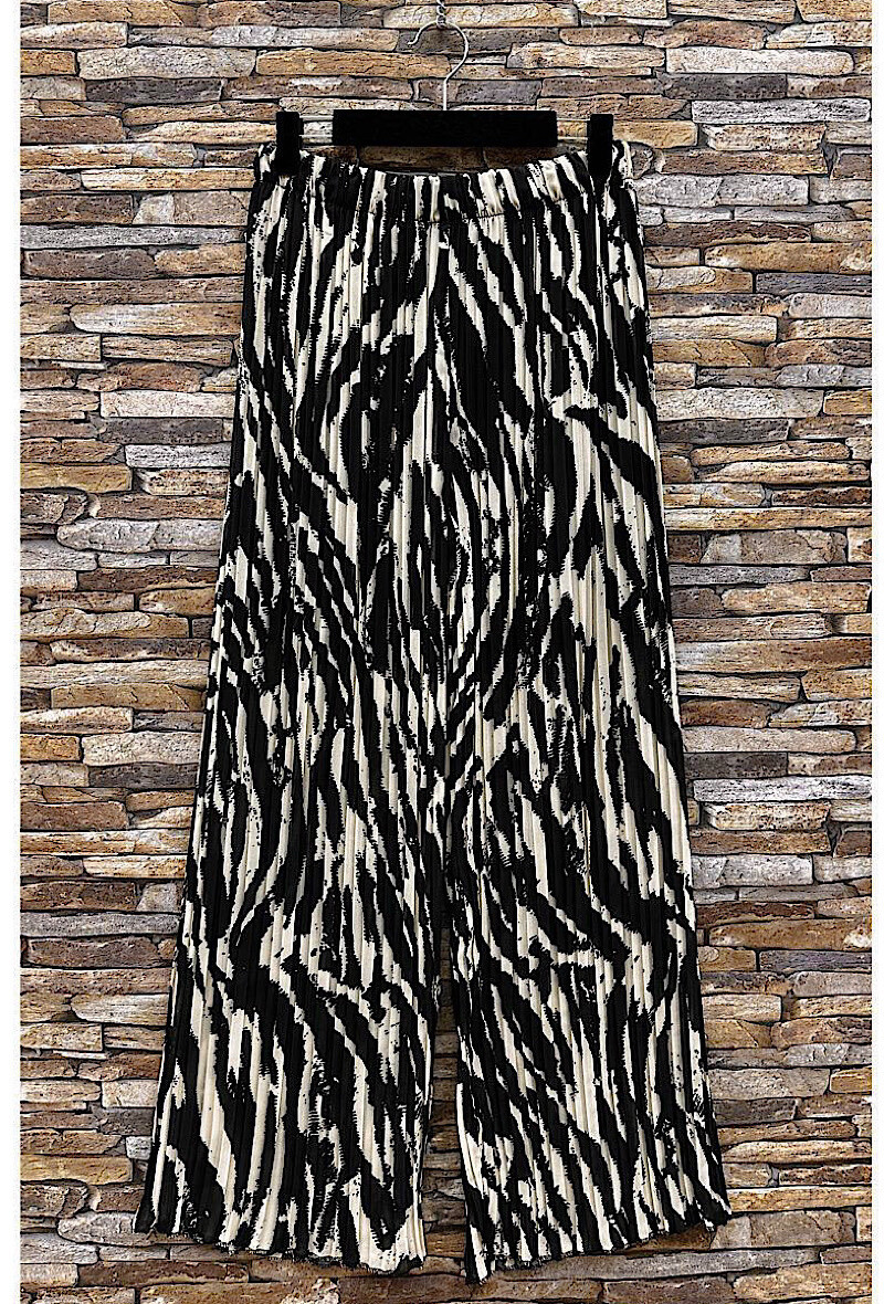 Grossista Elle Style - Pantaloni ALMA plissettati molto fluidi, stampati con fodera in viscosa.