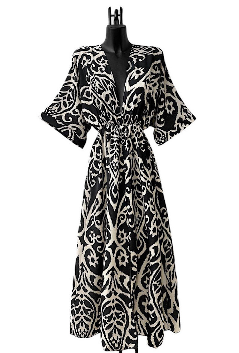 Grossiste Elle Style - Robe MARIA, fluide, chic et romantique avec fente avant.