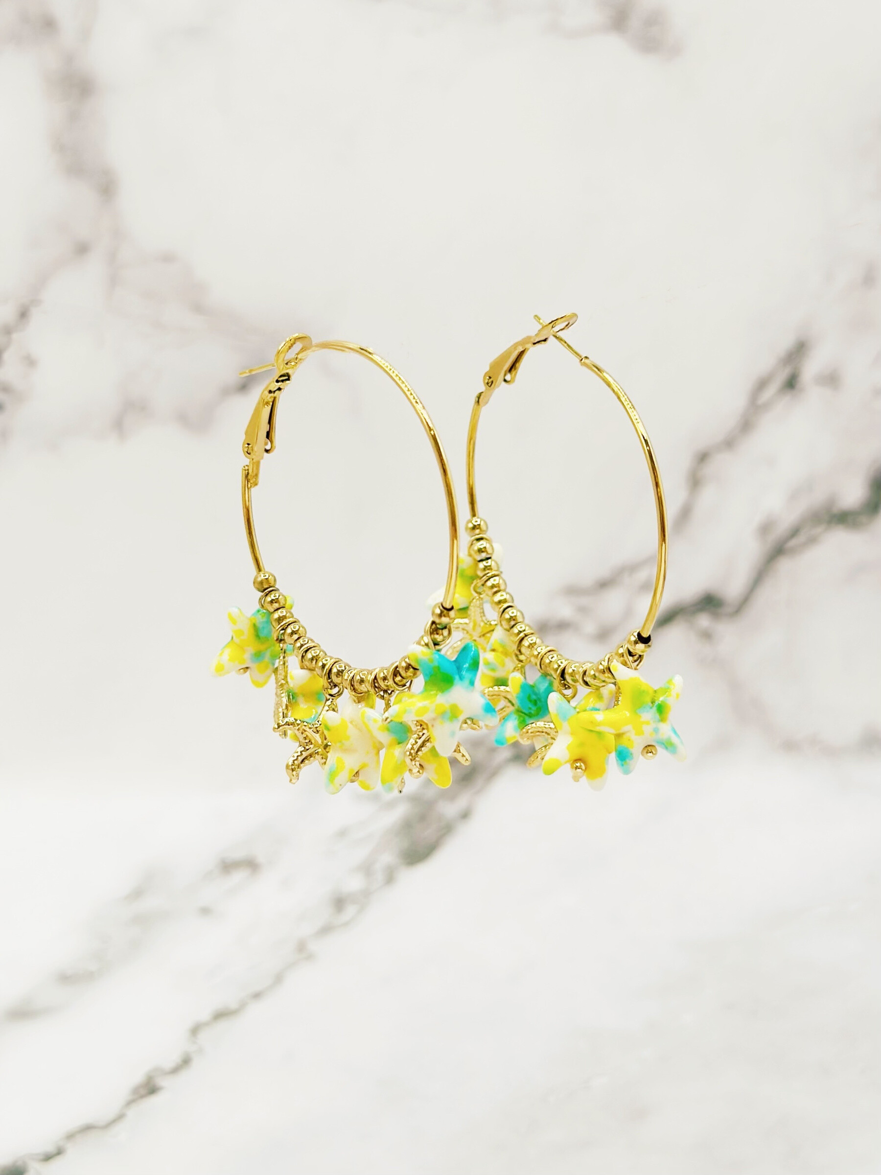 Grossiste Emily - Boucles d'oreilles en acier inoxydable Créoles Étoiles