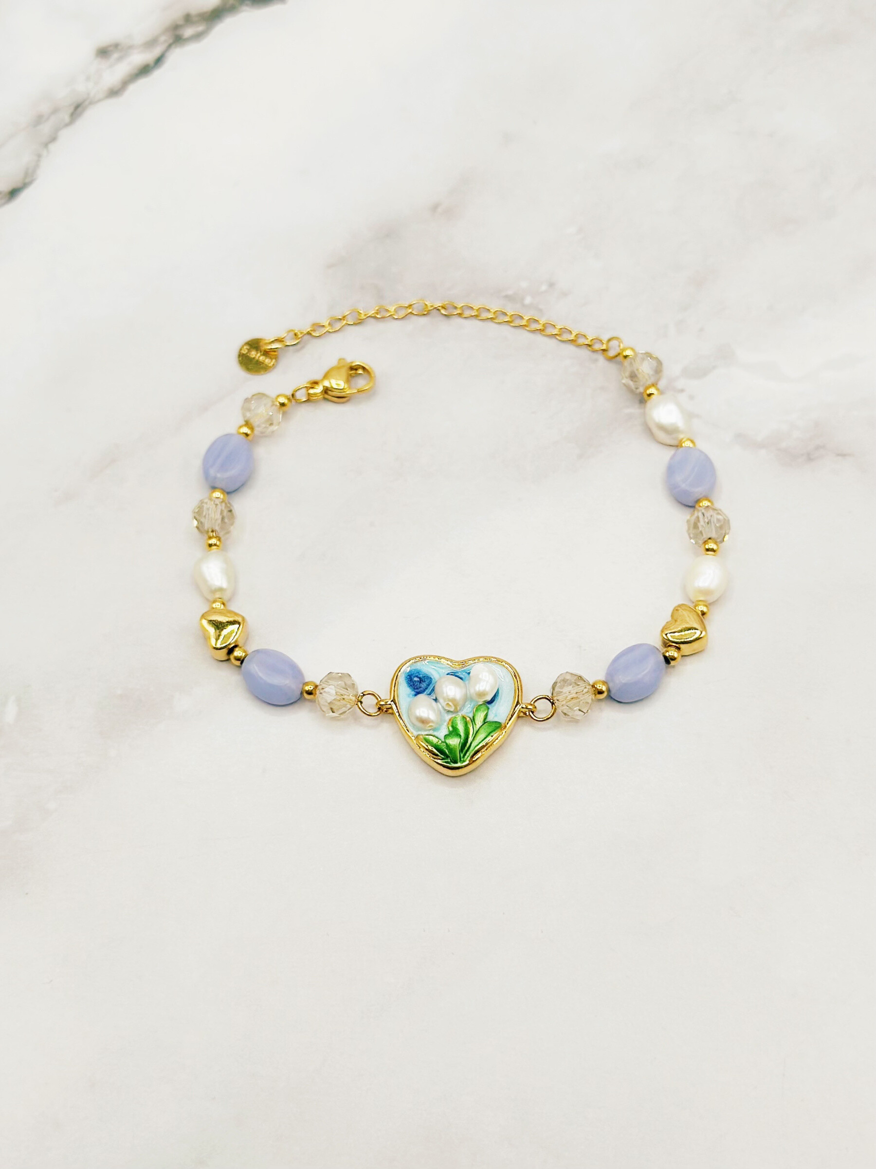 Grossista Emily - Bracciale in acciaio inossidabile regolabile con charms