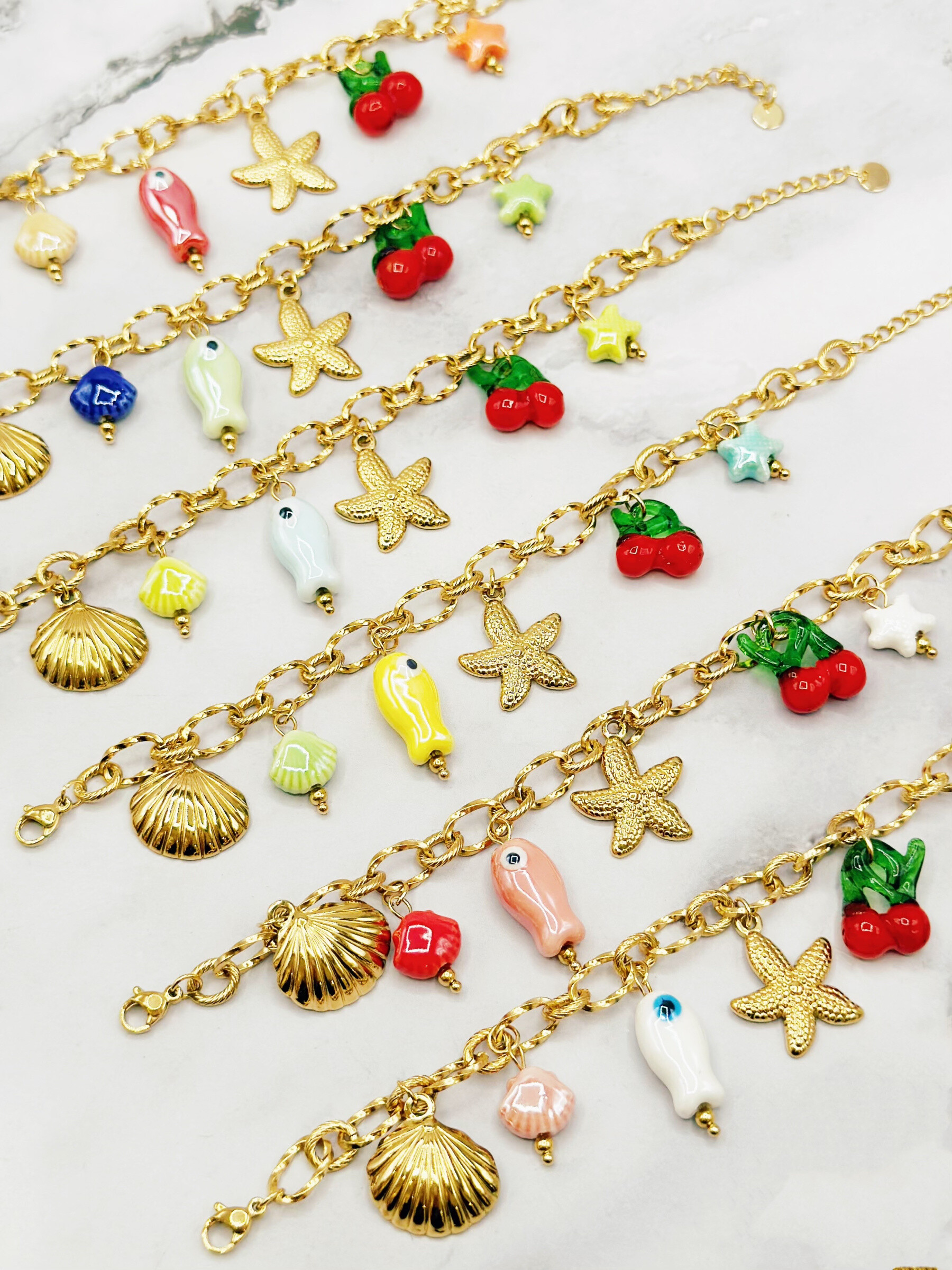 Grossiste Emily - Lot de 6/12 Bracelets acier inoxydable ajustableCharms