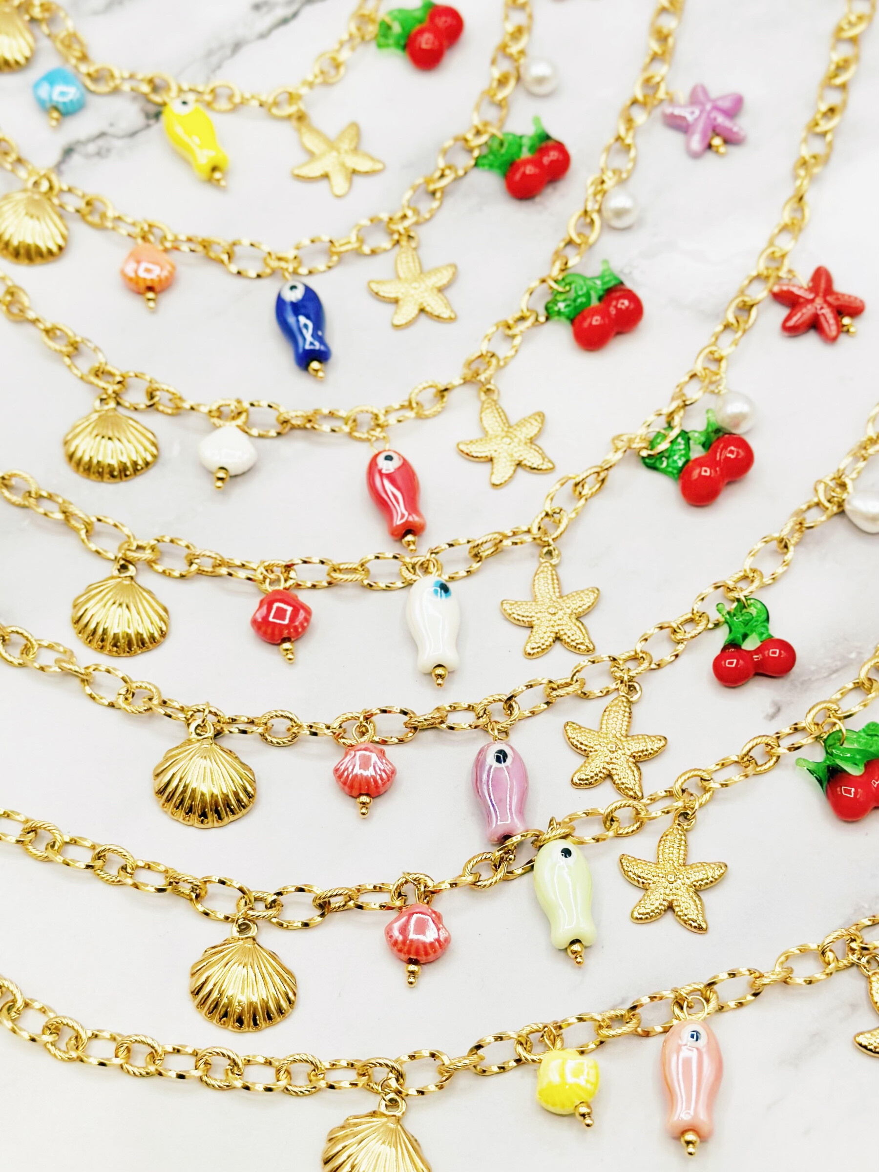 Grossiste Emily - Lot de 6/12 colliers acier inoxydable ajustable Charms