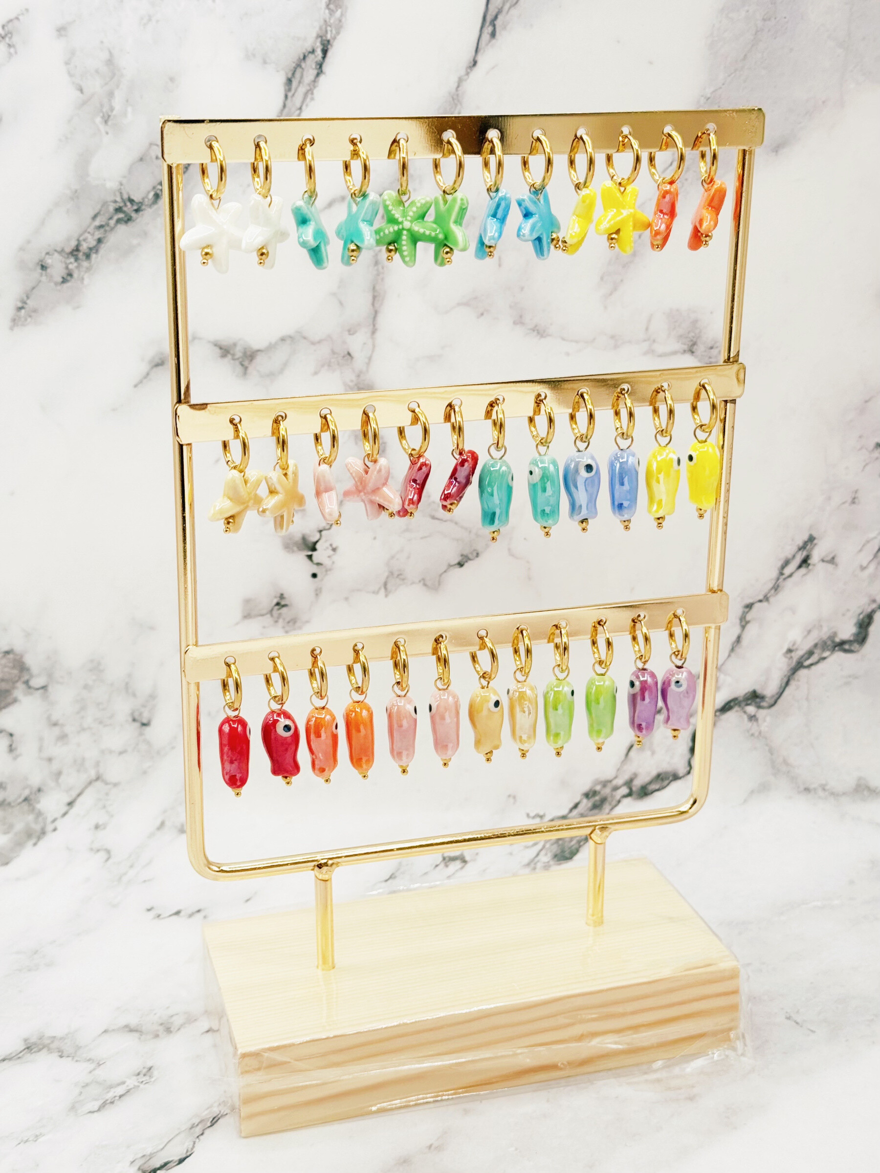 Grossiste Emily - Lot de 18 boucles créoles en acier inoxydable sur présentoir Céramique