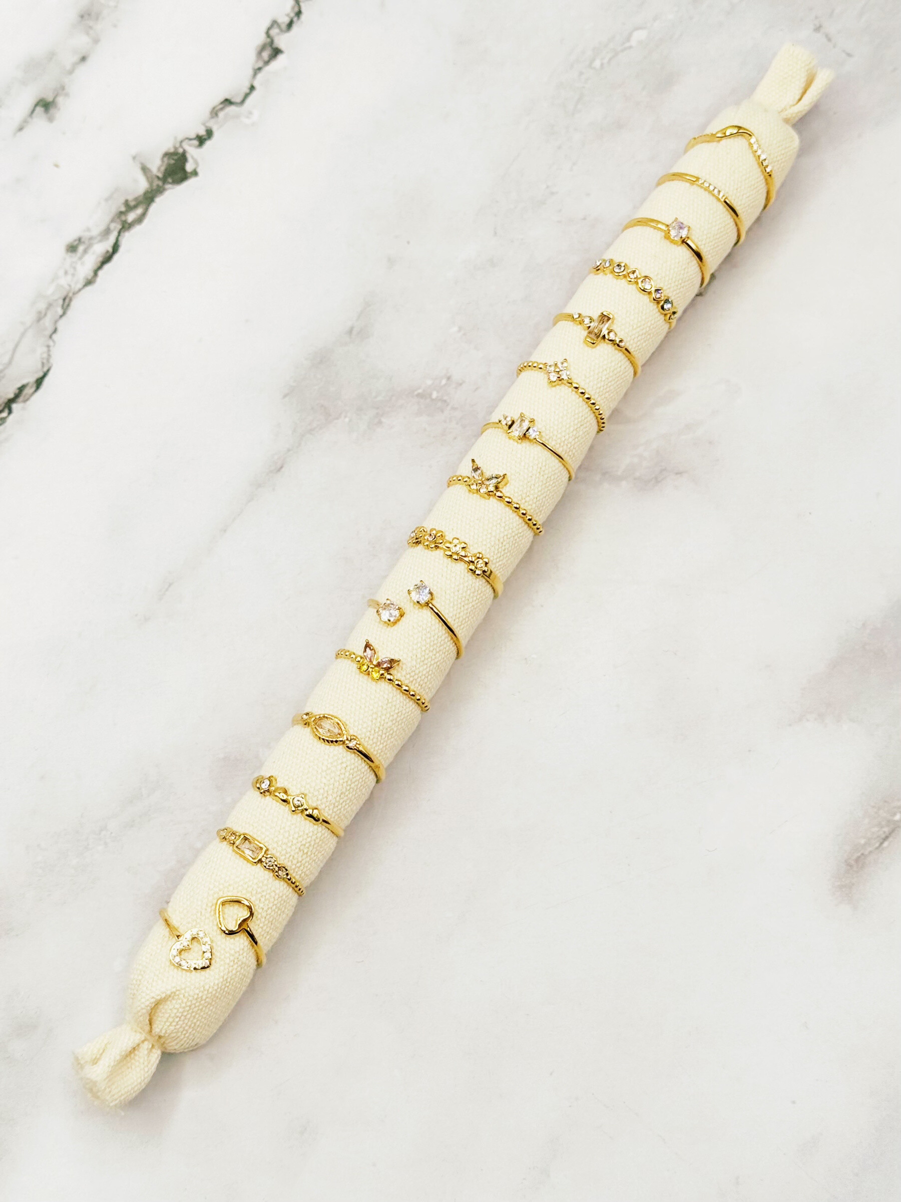 Grossiste Emily - 15 bagues ajustables en acier inoxydable sur boudin