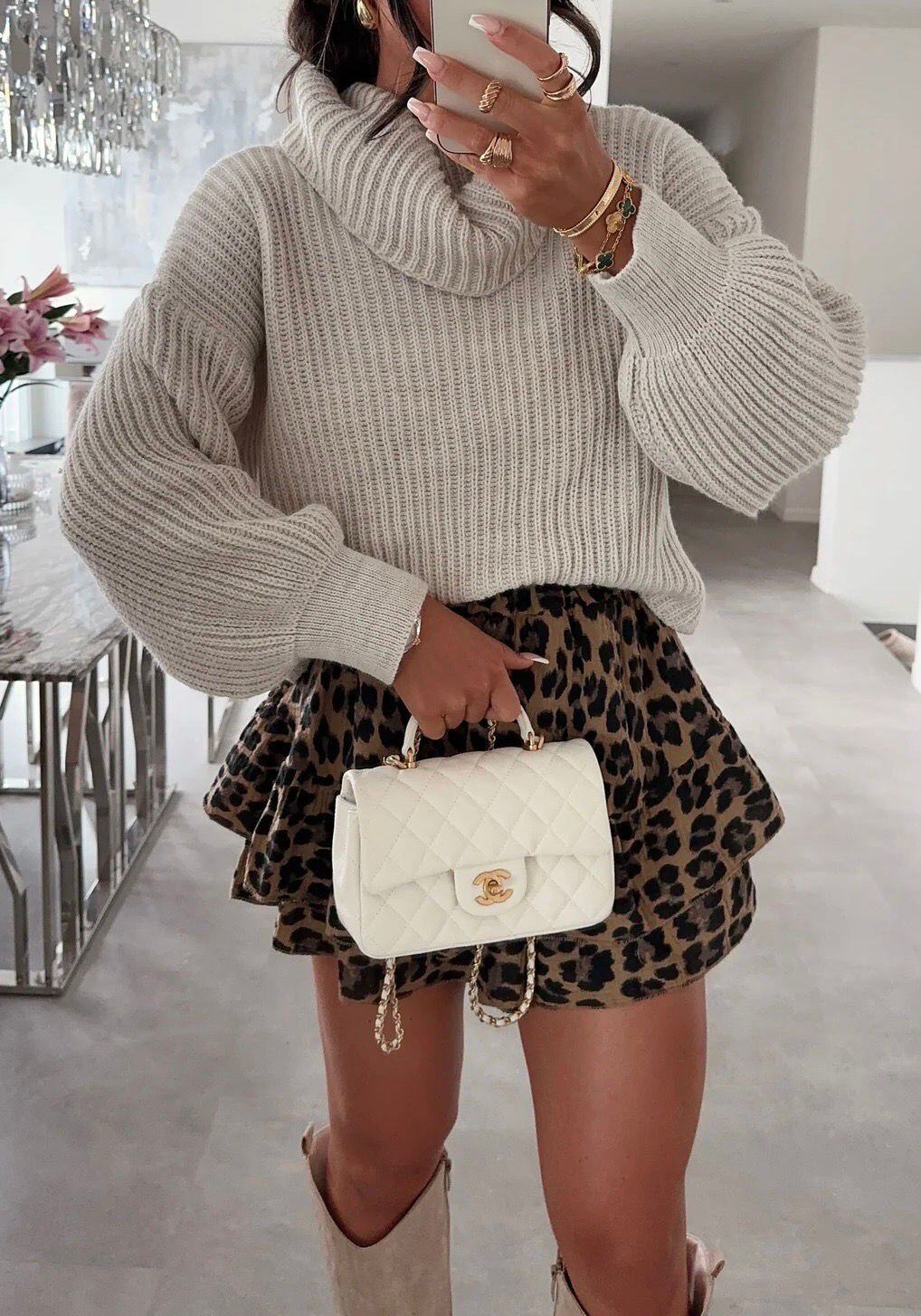 Knitted turtleneck sweater. The knit top is one size fits all.