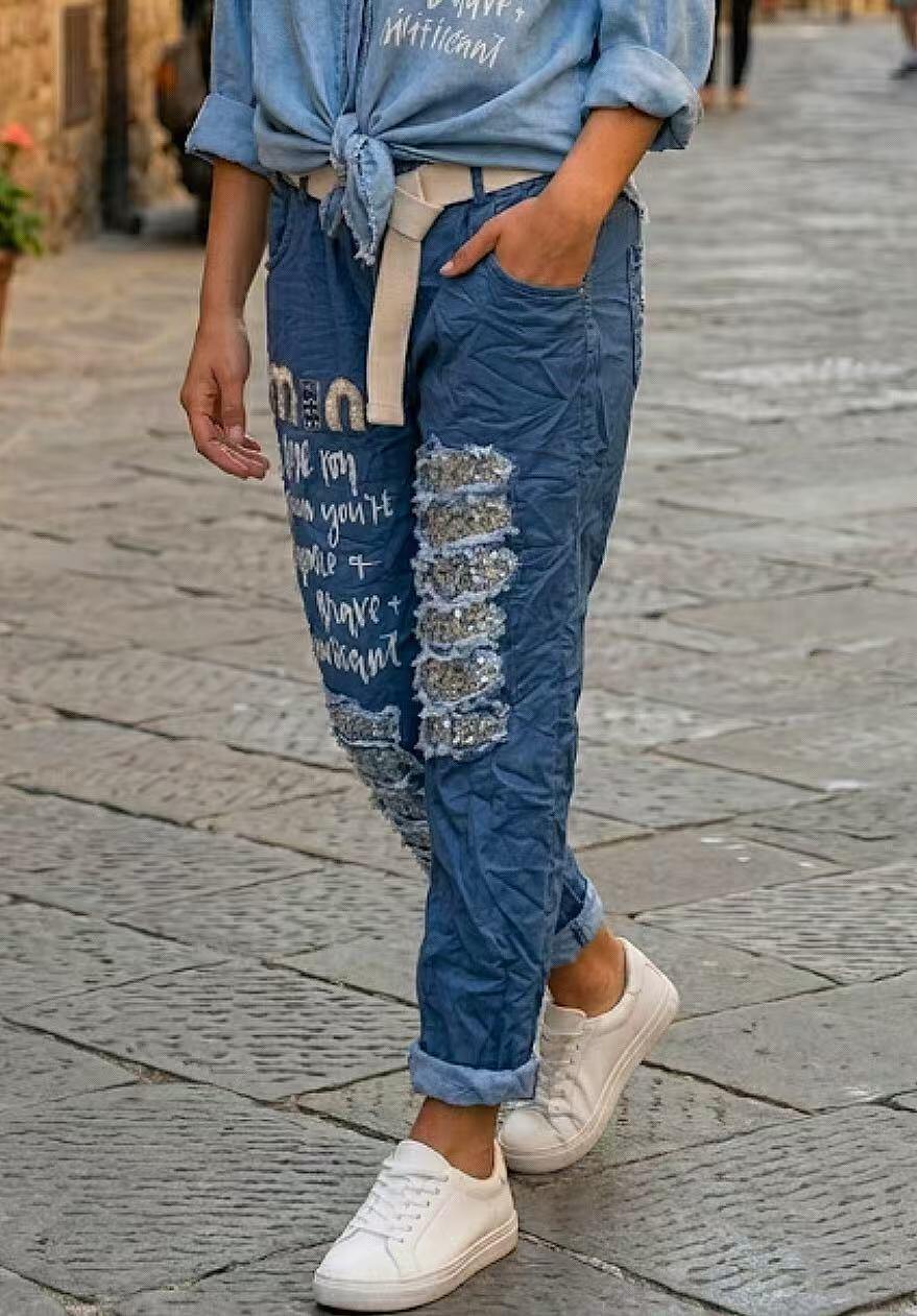 Grossista GI STUDIO - PANTALONE DA DONNA CON CINTURA E STAMPA DAVANTI, STRAPPATI CON PAYET