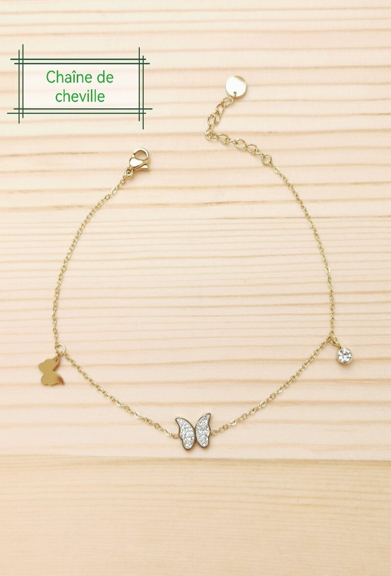 Grossiste Glam Chic - Chaîne de cheville papillon avec strass en acier inoxydable